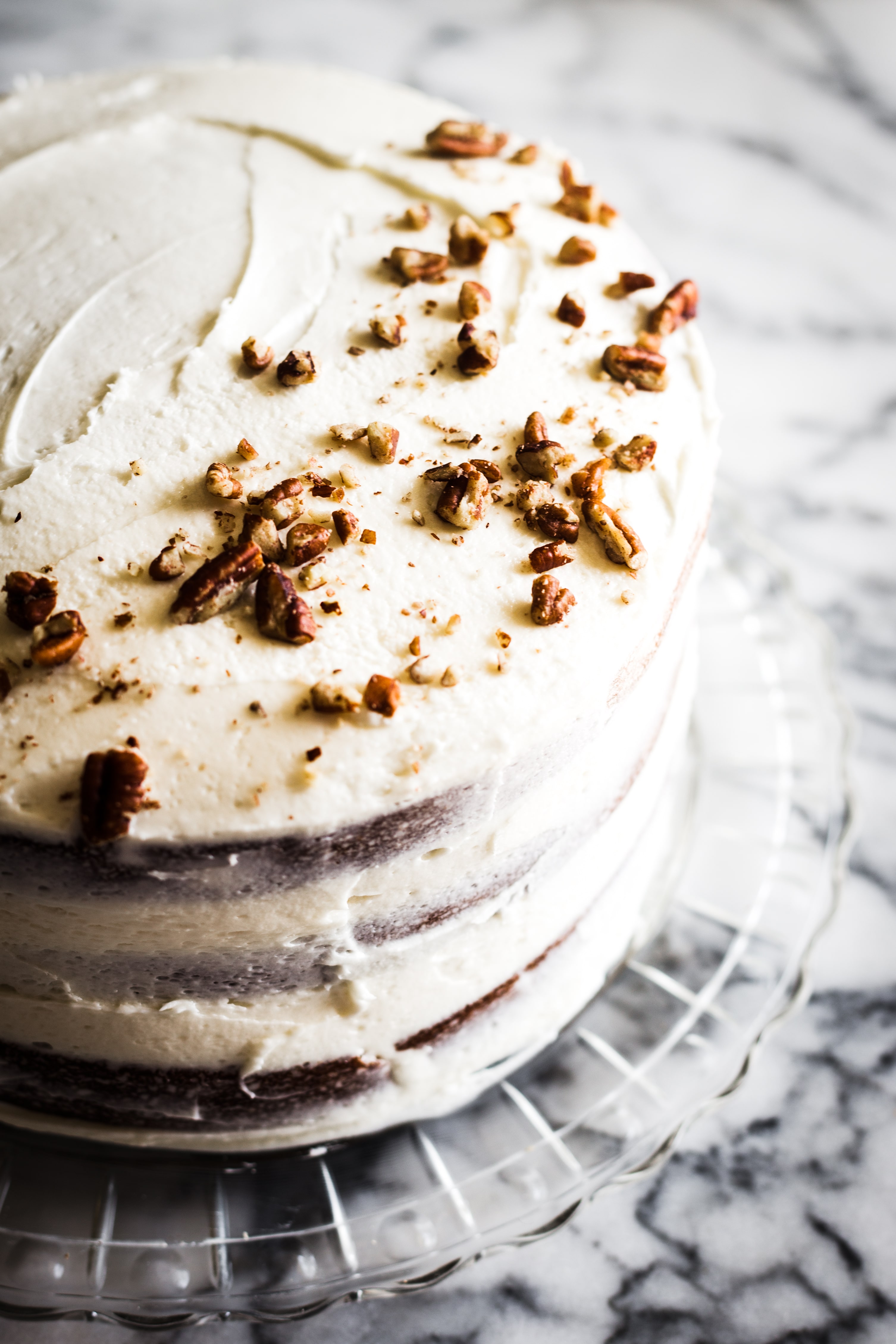 Similar in taste to carrot cake or spice cake, this Hummingbird Cake combines traditional and tropical flavors like banana and pineapple and is topped off with a classic buttercream frosting. 