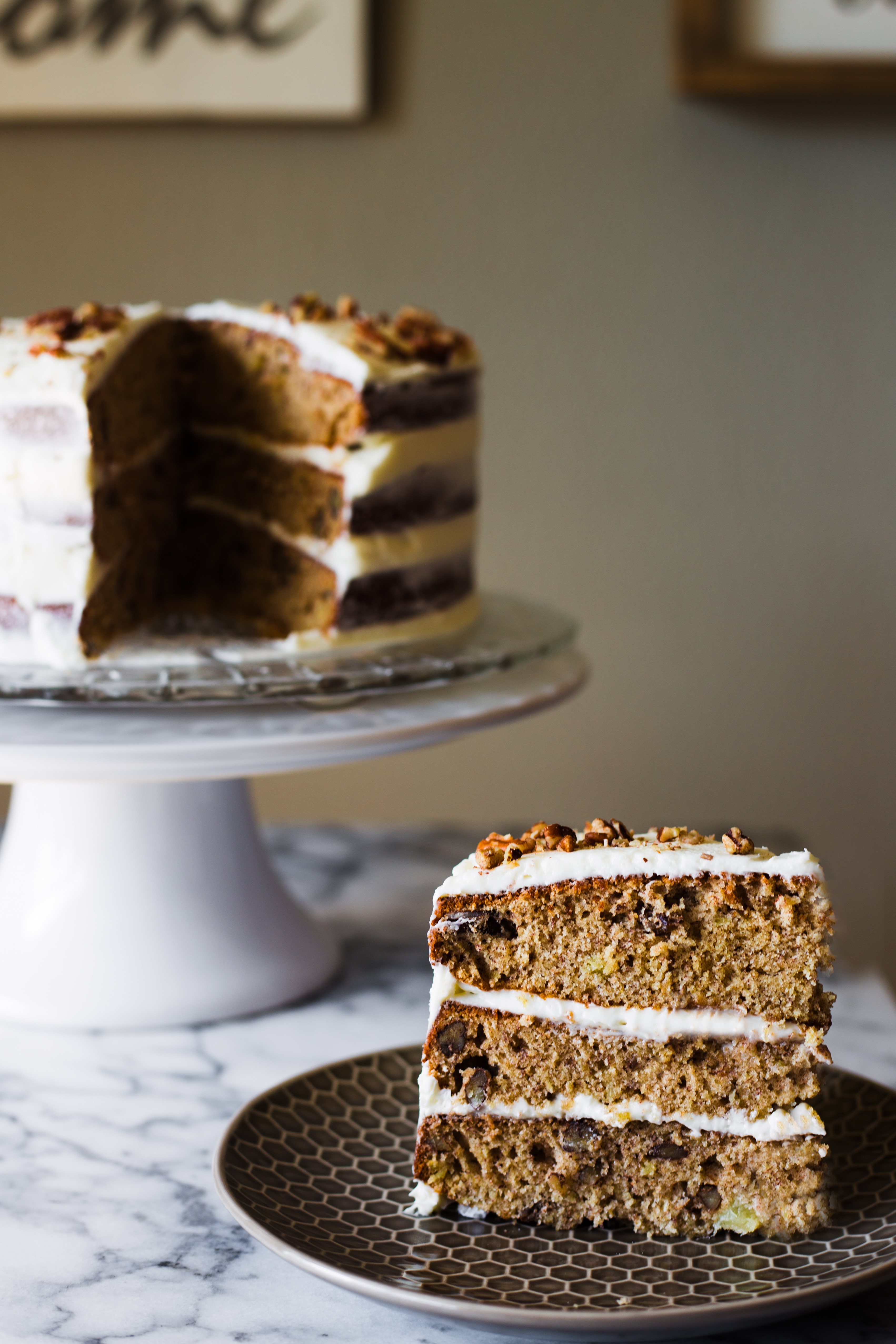 Similar in taste to carrot cake or spice cake, this Hummingbird Cake combines traditional and tropical flavors like banana and pineapple and is topped off with a classic buttercream frosting. 