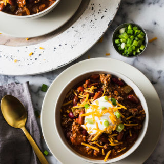 Easy Weeknight Chili - Just 8 ingredients to put this yummy and impressive dish on the table. Perfect for weeknights, tailgates, and freezer meals!
