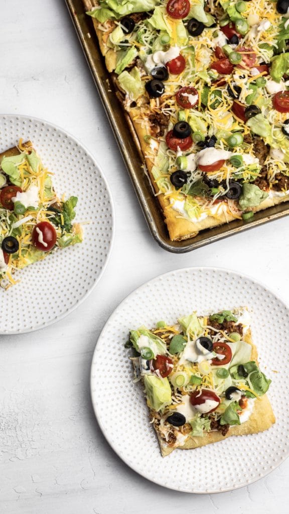 Taco Pizza combines two favorites for the perfect easy meal! This recipe is made using crescent roll dough for a tasty meal everyone will love!