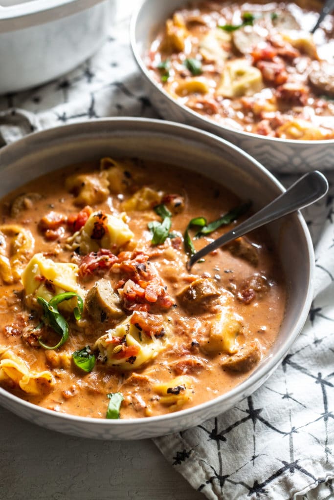 This Sausage Tortellini Soup comes together quickly with a rich and creamy tomato base, Italian chicken sausage and cheese tortellini.